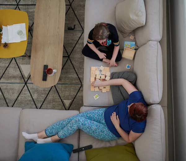 stock image mother and daughter at home playing memory game