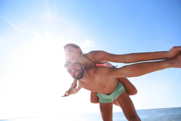 Handsome Man Giving Piggy Back His Girlfriend — Stock Photo, Image
