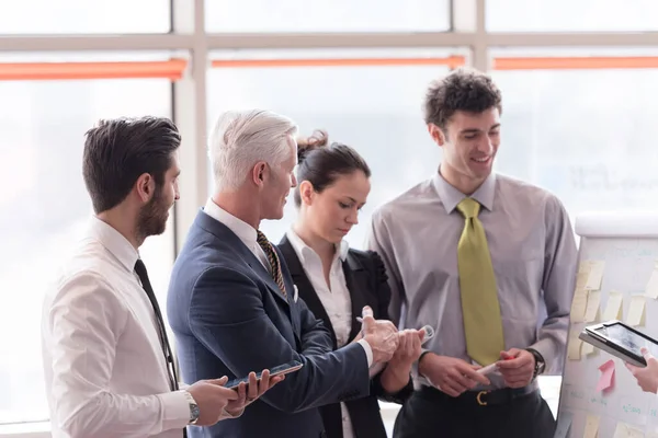 stock image young startup businessman making presentation to senior investor