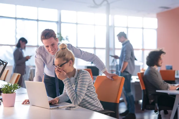 stock image Two Business People Working With laptop in office