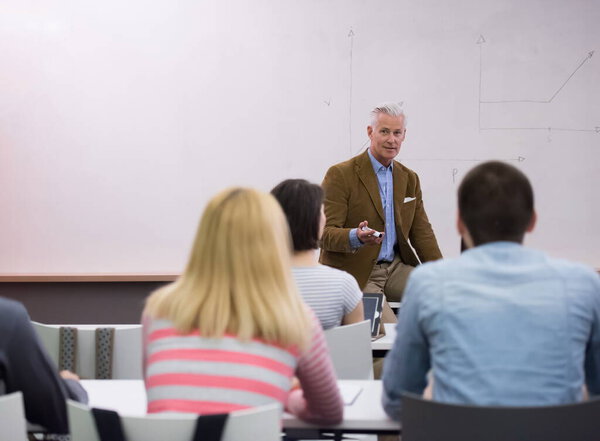 teacher with a group of students in classroom