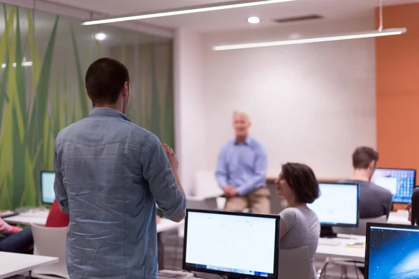 stock image student answering a question in classroom