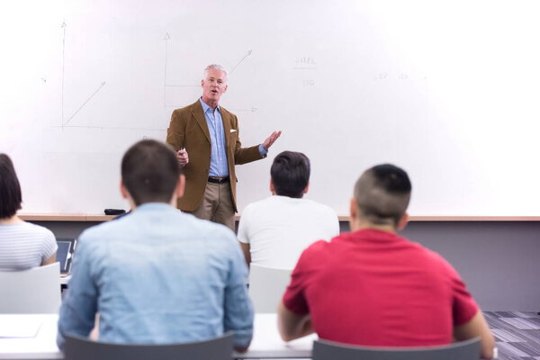 teacher with a group of students in classroom