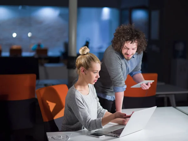 Stock image designers in the night startup office