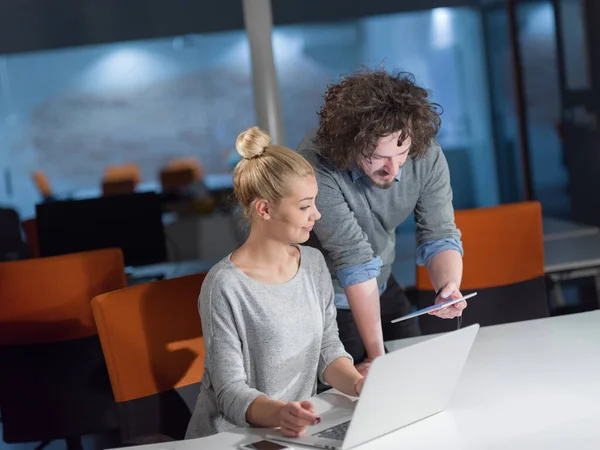 stock image designers in the night startup office