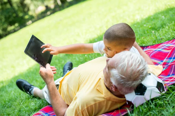 Grandfather Child Park Using Tablet — Stock Photo, Image