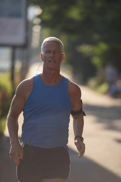 stock image handsome senior man jogging