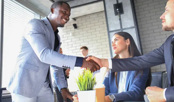 stock image Business handshake. Business people shaking hands, finishing up a meeting