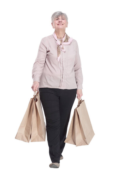 smiling old lady with shopping bags . isolated on a white