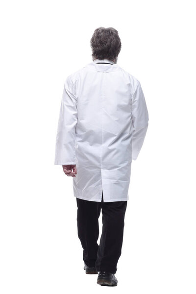 confident male doctor rushes to the call. isolated on a white