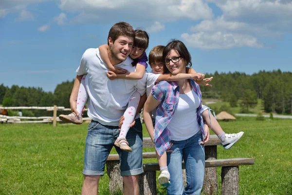 Happy Young Family Have Fun Outdoors Stock Photo