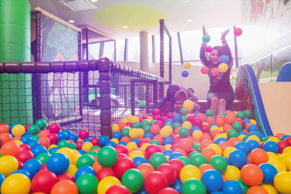 Young Mom Playing Kids Pool Colorful Balls — Stock Photo, Image