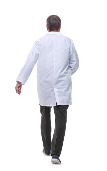 rear view. male doctor with a stethoscope striding away.