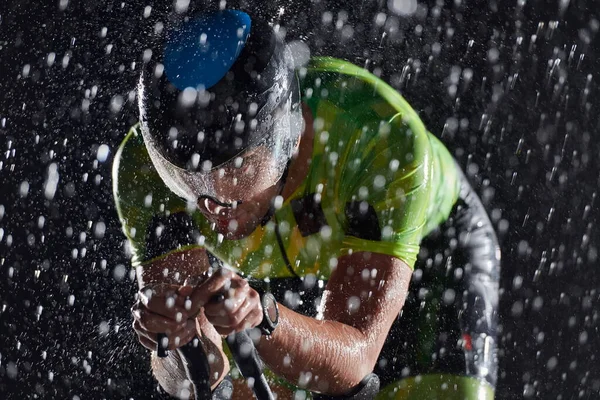 Triathlon Athlete Riding Bike Fast Rainy Night — Stock Photo, Image