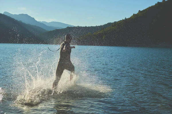 stock image triathlon athlete starting swimming training on lake