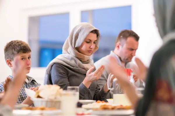Modern Multiethnic Muslim Family Praying Having Iftar Dinner —  Fotos de Stock