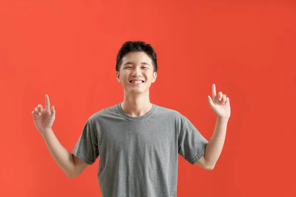 Happy Handsome Smiling Young Asian Man Hands Poiting Empty Space — Foto Stock