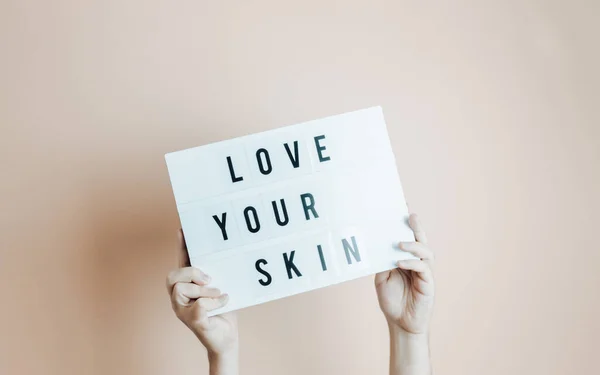 Hands Holding Sing Love Your Skin Written Minimal Desaturated Background — Stock Fotó