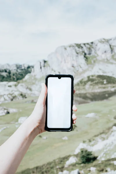 Moody wallpaper mobile phone with blank space, copy space in front of a colorful landscape of the mountains of Asturias during a sunny day, Covadonga lakes, peaceful scenario, snowy mountains, copy space