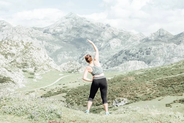 Lifestyle woman exercise and pose for healthy life. Young girl or people pose balance body vital zen and meditation for workout nature mountain background. Copy space for banner.