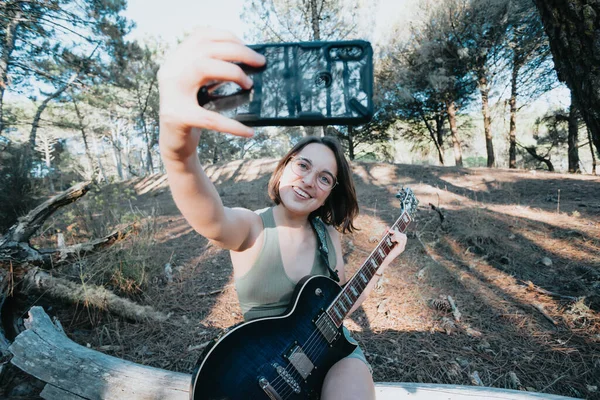 Young Hipster Girl Glasses Taking Selfie While Holding Electric Guitar — 图库照片