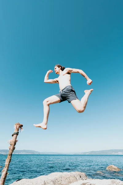 Young Male Long Hair Jumping Beach Shirtless Sunny Day Space — Stock Photo, Image