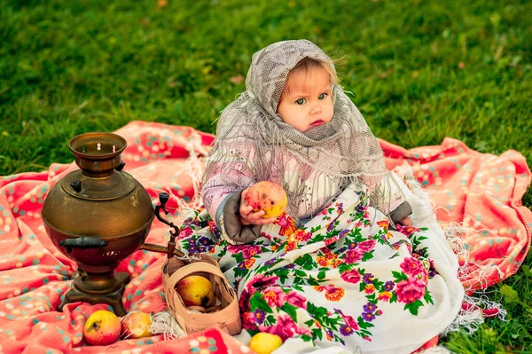 girl in a Russian costume. Little girl in traditional Russian folk costume.