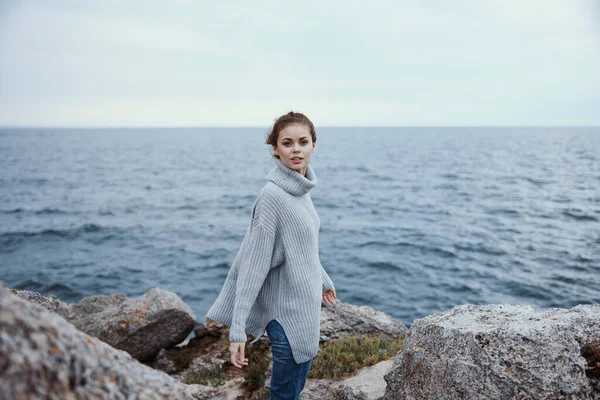 portrait of a woman sweaters cloudy sea admiring nature Lifestyle
