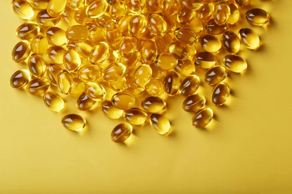 Pile Golden Capsules Vitamin Yellow Background Free Space — Stock Photo, Image