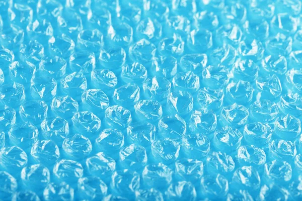 Verpakking Bubble Wrap Voor Pakketten Een Blauwe Achtergrond Volledig Scherm — Stockfoto