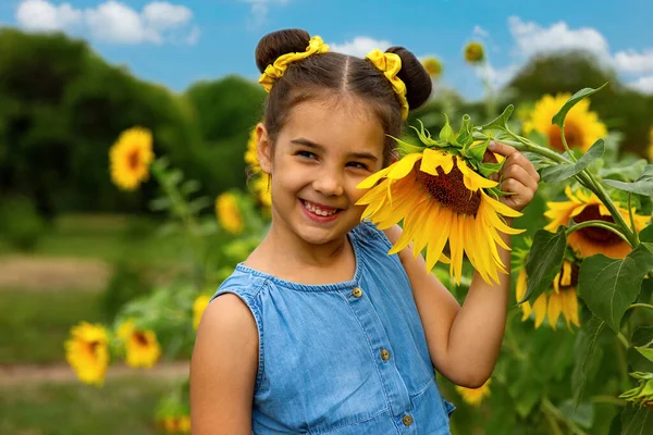 Happy Little Girl Blue Dress Stands Next Flowers Decorative Sunflower — Stock Photo, Image