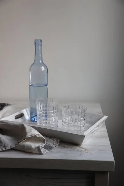 Blue Transparent Water Bottle Two Ribbed Glasses White Wooden Tray Royalty Free Stock Images