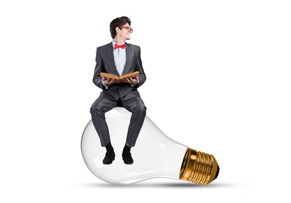Young Businessman Sits Light Bulb — Stock Photo, Image