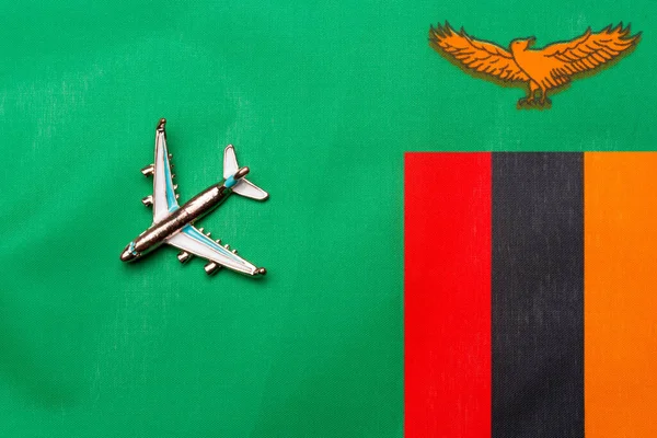 Avião Sobre Conceito Viagem Bandeira Zâmbia Avião Brinquedo Uma Bandeira — Fotografia de Stock