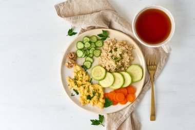 Balanced gluten free food, brown rice zucchini with scramble, dash fodmap diet clipart