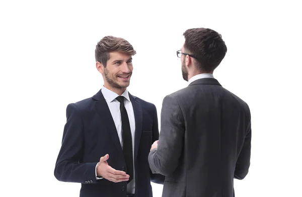 stock image in full growth. two young businessmen discussing something