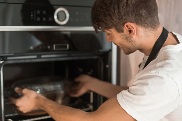Young Man Warming Dinner Oven — Stock Photo, Image