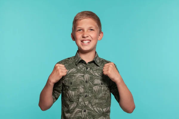 Close Portrait Blonde Teenage Boy Green Shirt Posing Blue Studio — Stock Photo, Image