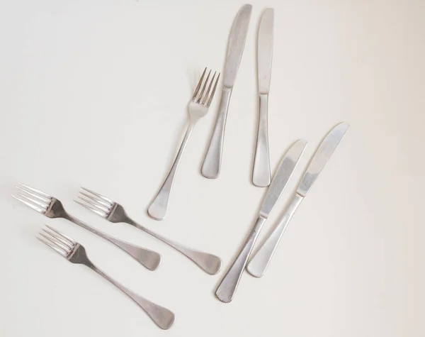 Gıda Arka Planı Beyaz Masadaki Dört Çatal Bıçağın Yüksek Açılı — Stok fotoğraf