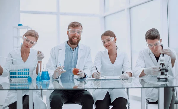 group of medical experts checking the quality of fruit