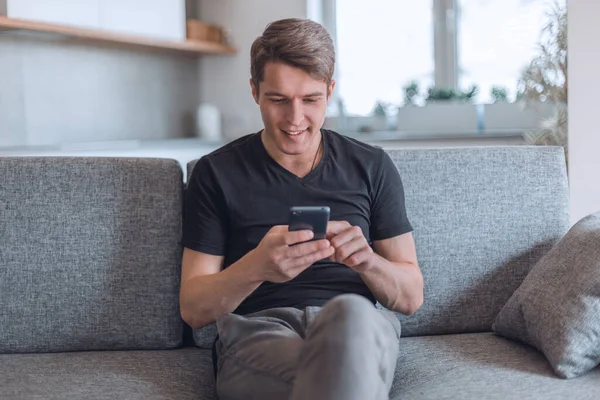 Smiling Young Man Reading Correspondence His Smartphone — Stock Photo, Image