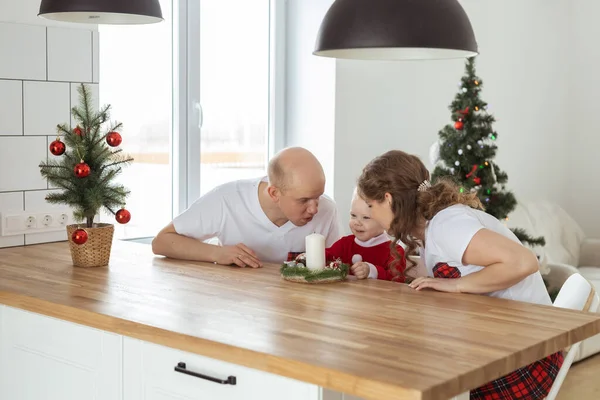 stock image Baby child with hearing aid and cochlear implant having fun with parents in Christmas room. Deaf , diversity and health concept