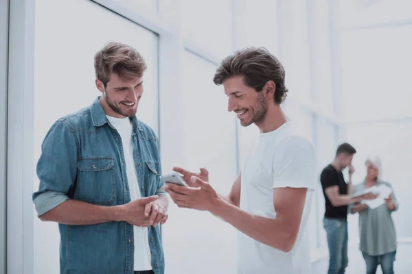 stock image colleagues discuss Internet news during a work break .