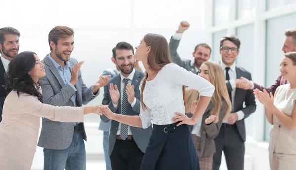 happy employees congratulating their leader. the concept of victory