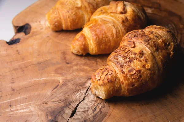 Close Three Delicious Croissant Almonds Wooden Pallet Delicious Healthy Breakfast — Stockfoto