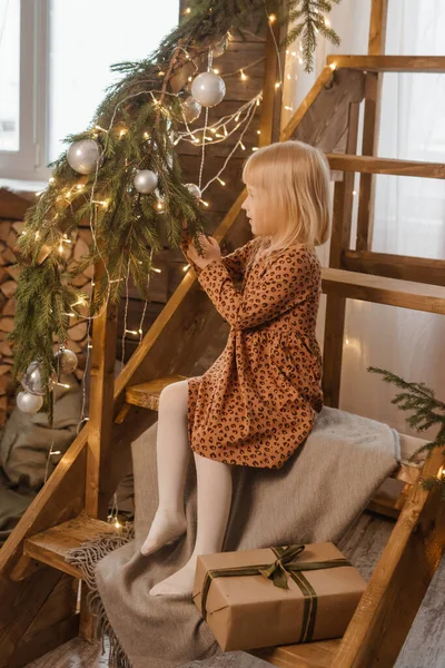 Little Blonde Girl Sitting Wooden Staircase Scandinavian Interior Decorated — Stok fotoğraf