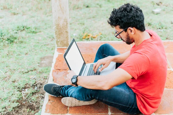 Side View Student Man Sitting Cross Legged Floor His Laptop — Stock Fotó