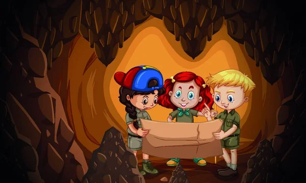 A group of children reading cave map