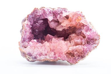 Macro focused vibrant pink amethyst quartz geode crystal, rose hematite amethyst points isolated on a white background surface