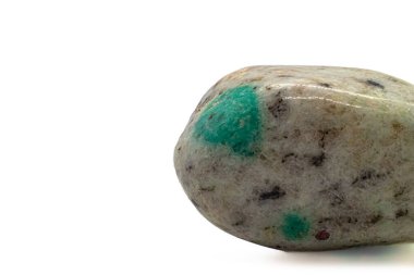 Focused Green K2 Jasper tumbled crystal, K2 granite, tumbled stone green azurite - malachite on white granite macro photography isolated on a white surface background 